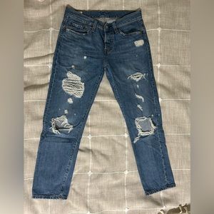 Levis Strauss 501. Mid-rise, straight cut, tattered jeans. Size 26.